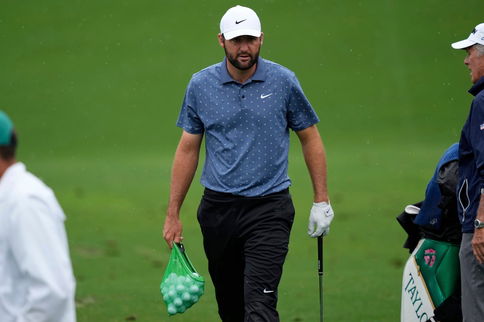 Scottie Scheffler warms up on the driving range during a practice round at the Masters golf tournament, Monday, April 7, 2025, in Augusta, Ga. (AP Photo/Matt Slocum)