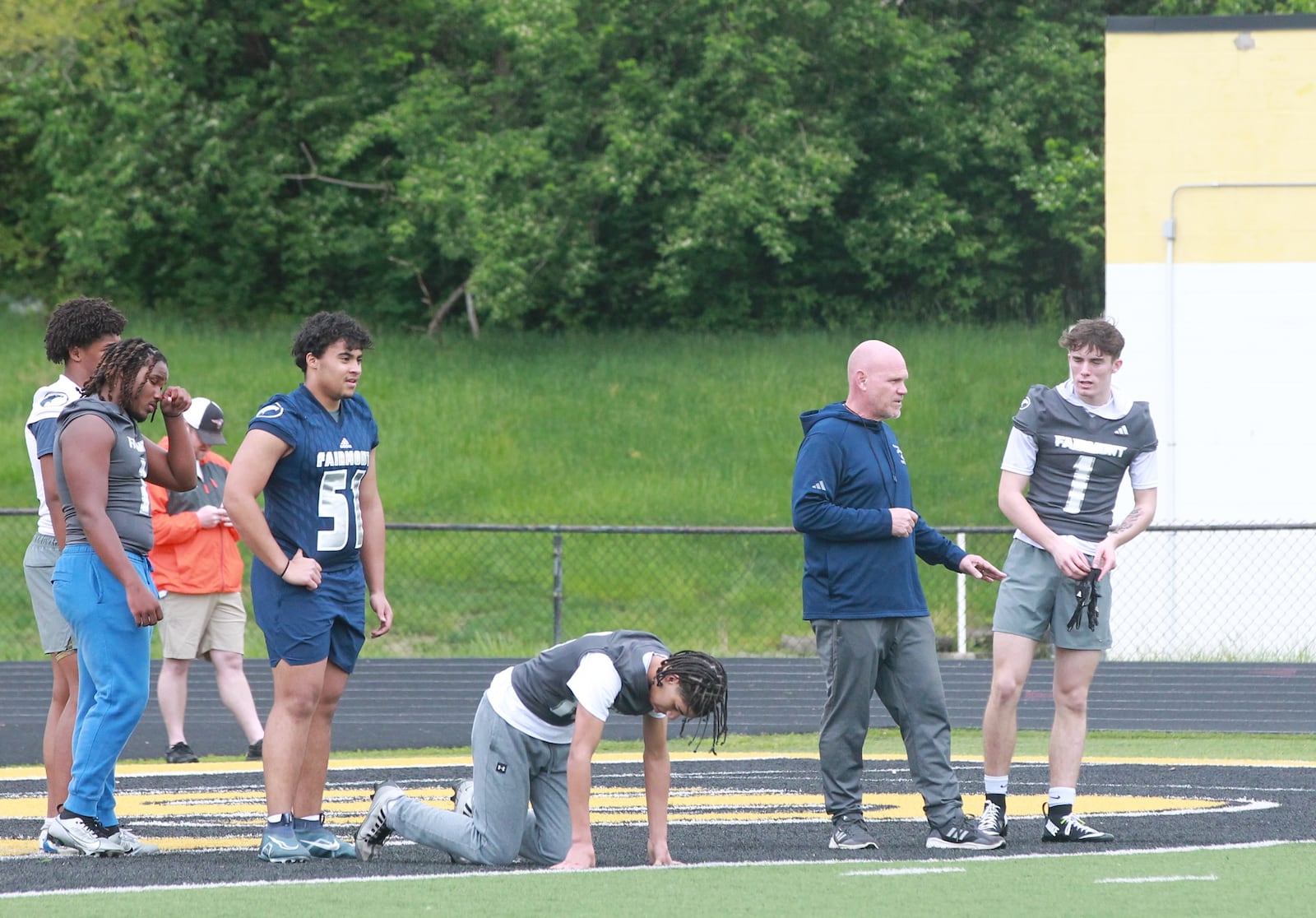 Miami Valley high school football recruiting showcase: Fairmont coach Dave Miller directs workouts in Centerville
