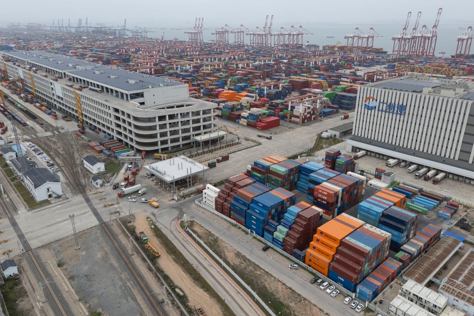 FILE - Shipping containers are seen ready for transport at the Guangzhou Port in the Nansha district in southern China's Guangdong province on April 17, 2025. (AP Photo/Ng Han Guan, File)
