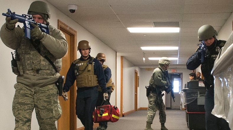 Wright-Patterson Air Force Base Security Forces and emergency-response personnel enter a base facility during a previous active-shooter exercise. Active-shooter response is the focus of a base-wide exercise Feb. 24. U.S. AIR FORCE PHOTO/WESLEY FARNSWORTH