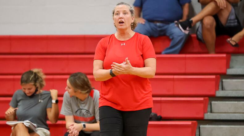 Southeastern High School coach Kathy Mercer instructs her team from the sideline before the second game during the Trojans match against Northeastern on Wednesday, Sept. 15 in South Charleston. Mercer recently earned her 500th career victory. CONTRIBUTED PHOTO BY MICHAEL COOPER