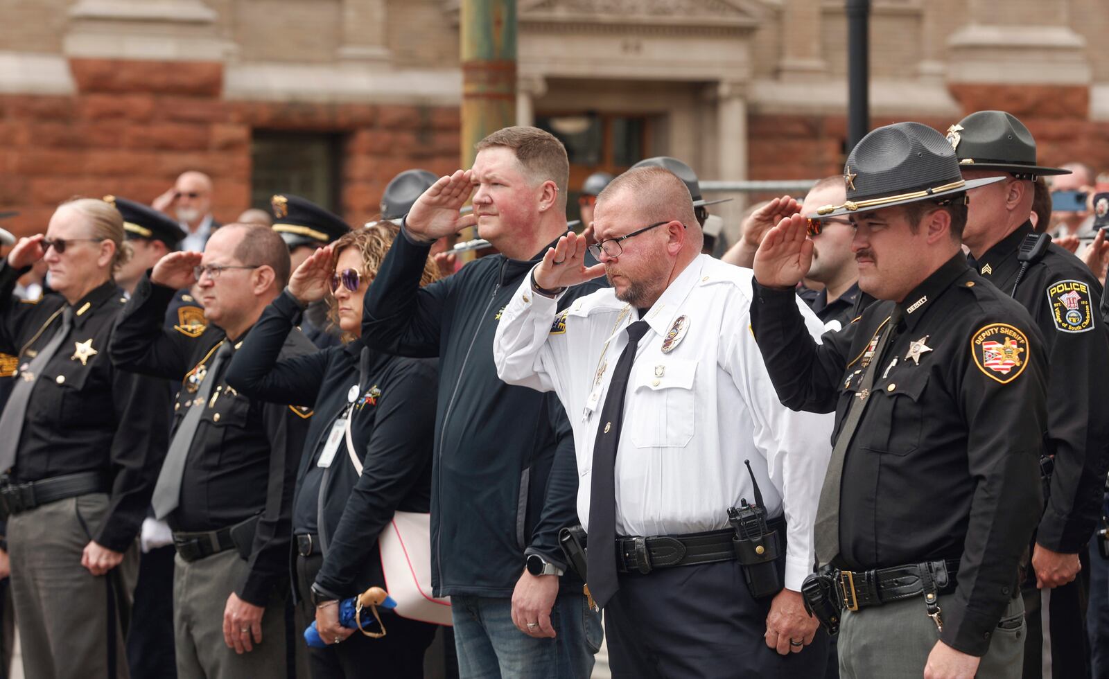 Officers pay respects during a rifle salute at Public Safety Forces Day on Friday, May 2, 2025, near the Clark County Public Safety Memorial. JOSEPH COOKE/STAFF