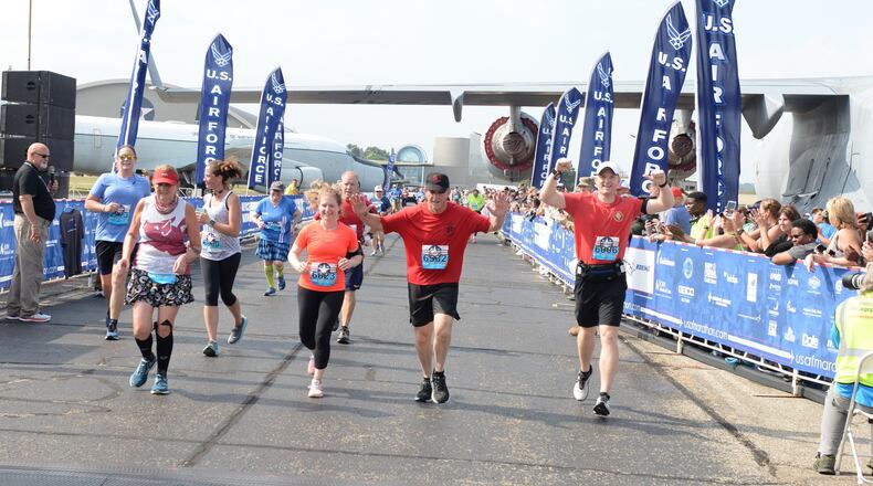 Gen. David L. Goldfein celebrates as he crosses the finish line at the 23rd Air Force Marathon at Wright-Patterson Air Force Base on Saturday. (U.S. Air Force photo by Wesley Farnsworth)
