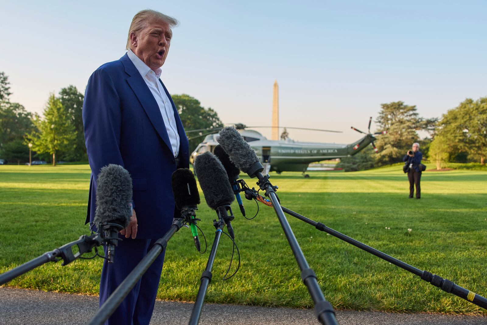 President Donald Trump speaks with reporters before boarding Marine One on the South Lawn of the White House, Tuesday, June 24, 2025, in Washington. (AP Photo/Evan Vucci)