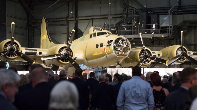 Crowds gather around the B-17F Memphis Belle to get a better look at the conclusion of its unveiling ceremony at the Memphis Belle exhibit inside the National Museum of the U.S. Air Force, Wright-Patterson Air Force Base, May 16. The Memphis Belle is the most famous Flying Fortress, having been the first able to return to the United States following 25 combat missions over occupied Europe during World War II. (U.S. Air Force photo/Wesley Farnsworth)