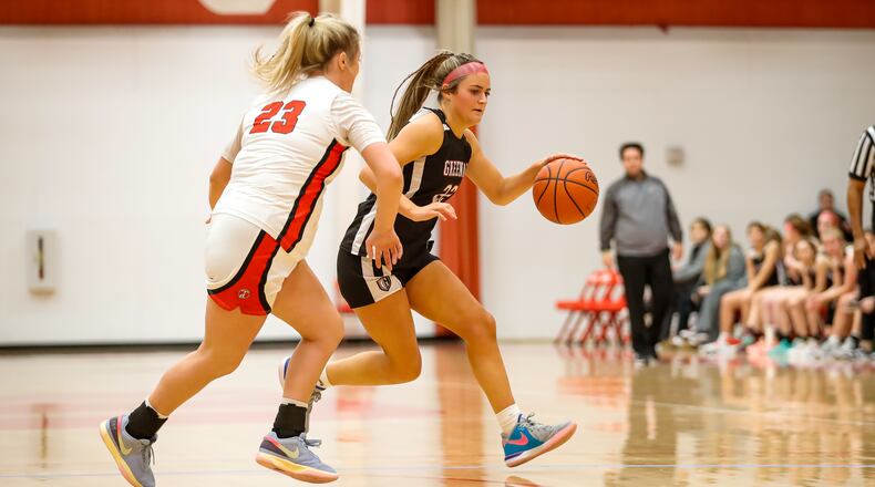 Greenon High School junior Avery Minteer drives past Tecumseh senior Brooklyn Noble during their game on Thursday, Dec. 28, 2023 at the Clark County Basketball Showcase at Pam Evans Smith Arena in Springfield. Michael Cooper/CONTRIBUTED