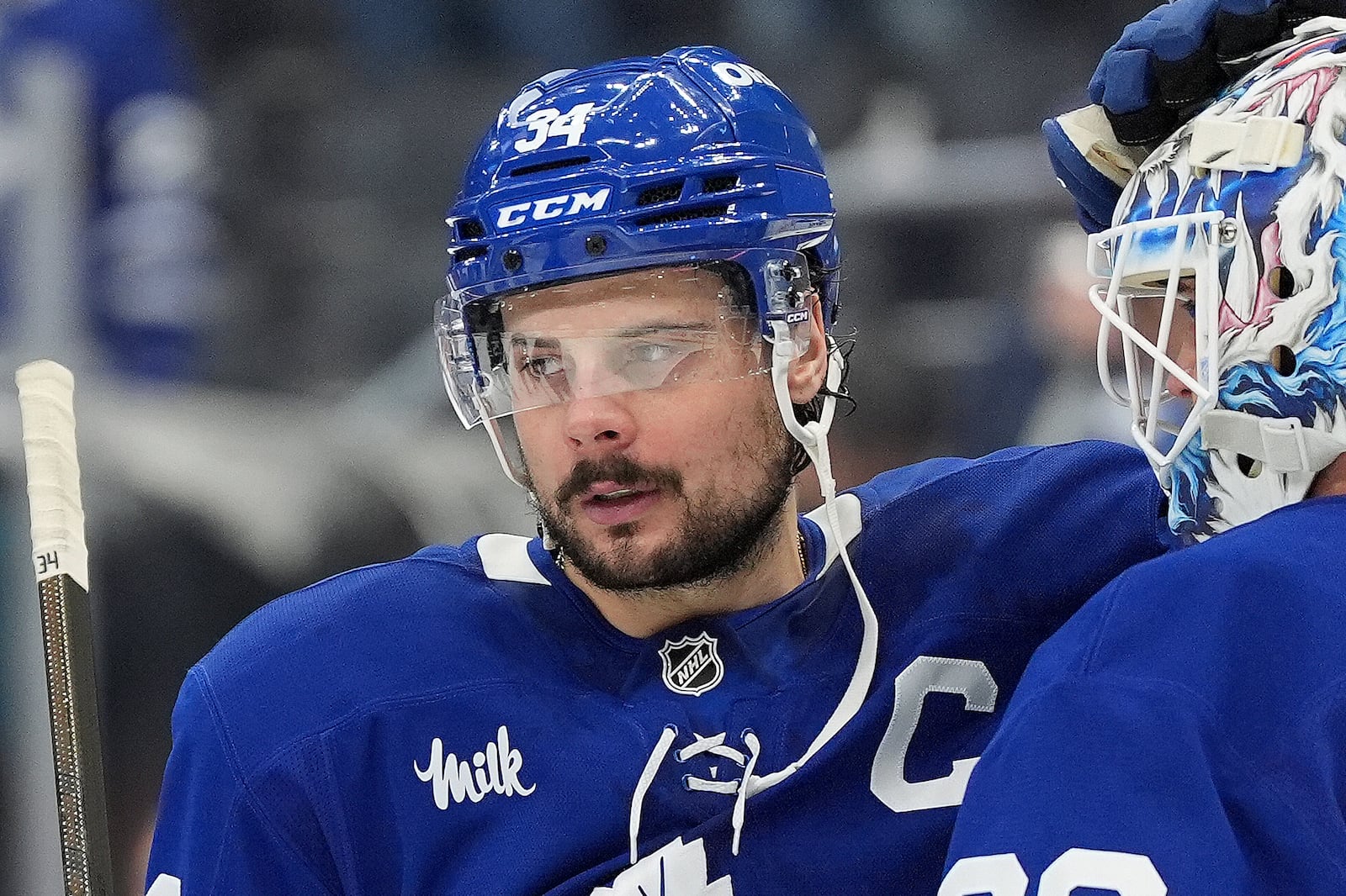 FILE - Toronto Maple Leafs centre Auston Matthews (34) consoles teammate Joseph Woll (60) in the final moments of the third period of Game 7 of a second-round NHL hockey playoff series in Toronto, May 18, 2025. (Frank Gunn/The Canadian Press via AP, File)