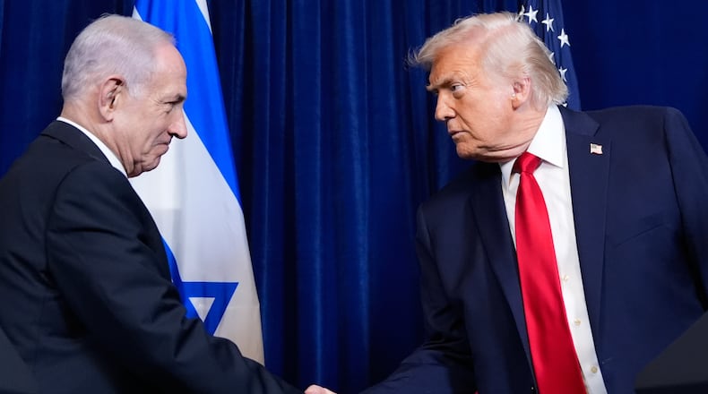 FILE - President Donald Trump shakes hands with Israel's Prime Minister Benjamin Netanyahu during a news conference at Mar-a-Lago, Dec. 29, 2025, in Palm Beach, Fla. (AP Photo/Alex Brandon, File)