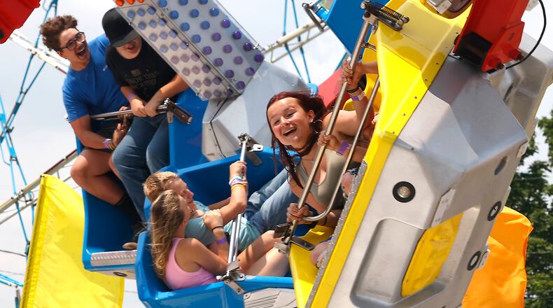 Fairgoers enjoy the rides on the midway at the Clark County Fair Wednesday, July 24, 2024. BILL LACKEY/STAFF