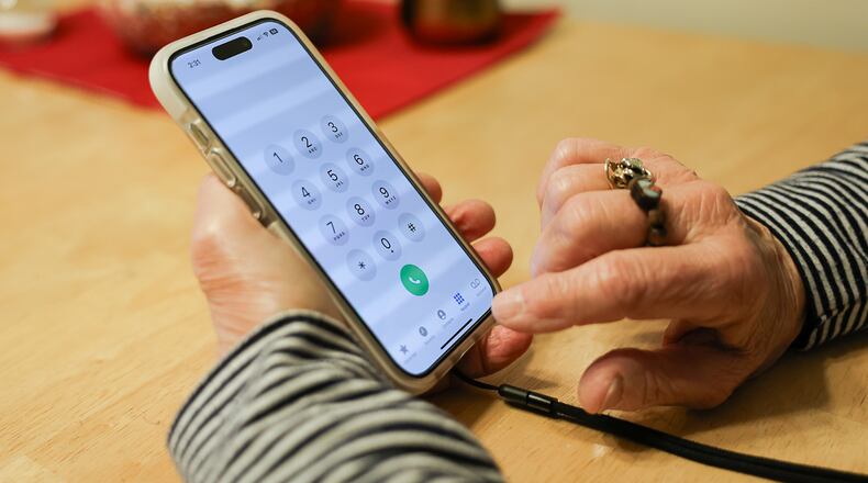 A Dayton area woman lost over $50,000 to scammers and is telling her story to warn others. BRYANT BILLING / STAFF