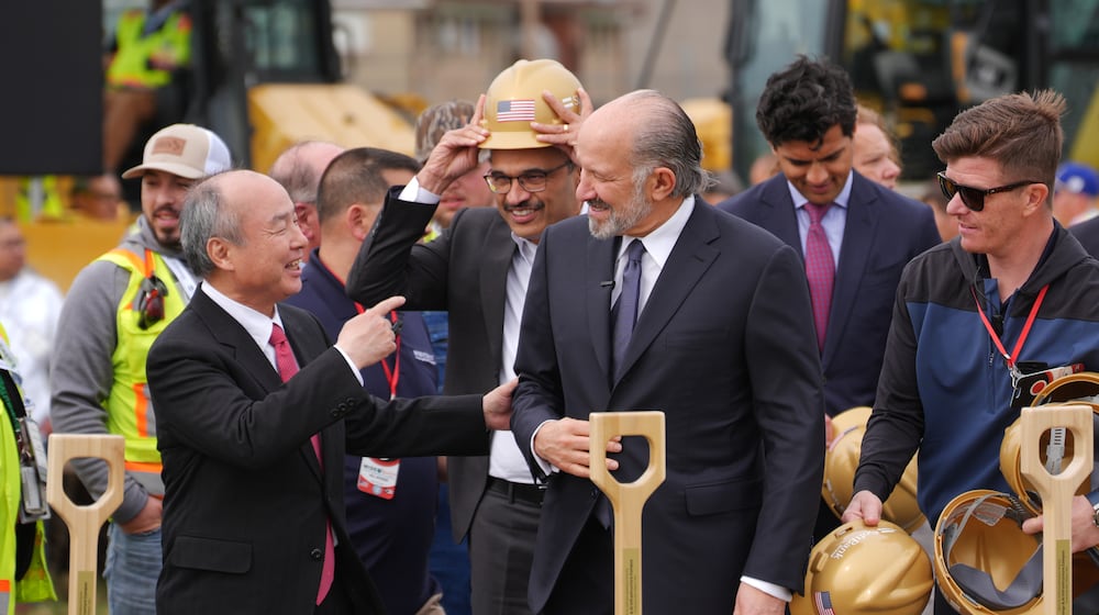 Masayoshi Son, Chairman and CEO of SoftBank Group Corp., left, and Howard Lutnick, Secretary of Commerce speak at a groundbreaking for a new data center Friday, March 20, 2026, in Piketon, Ohio. (AP Photo/Joshua A. Bickel)