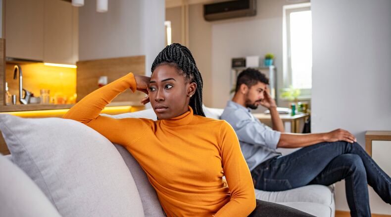 An unhappy couple has an argument at home. ISTOCK IMAGE/COPYRIGHTED (ljubaphoto)