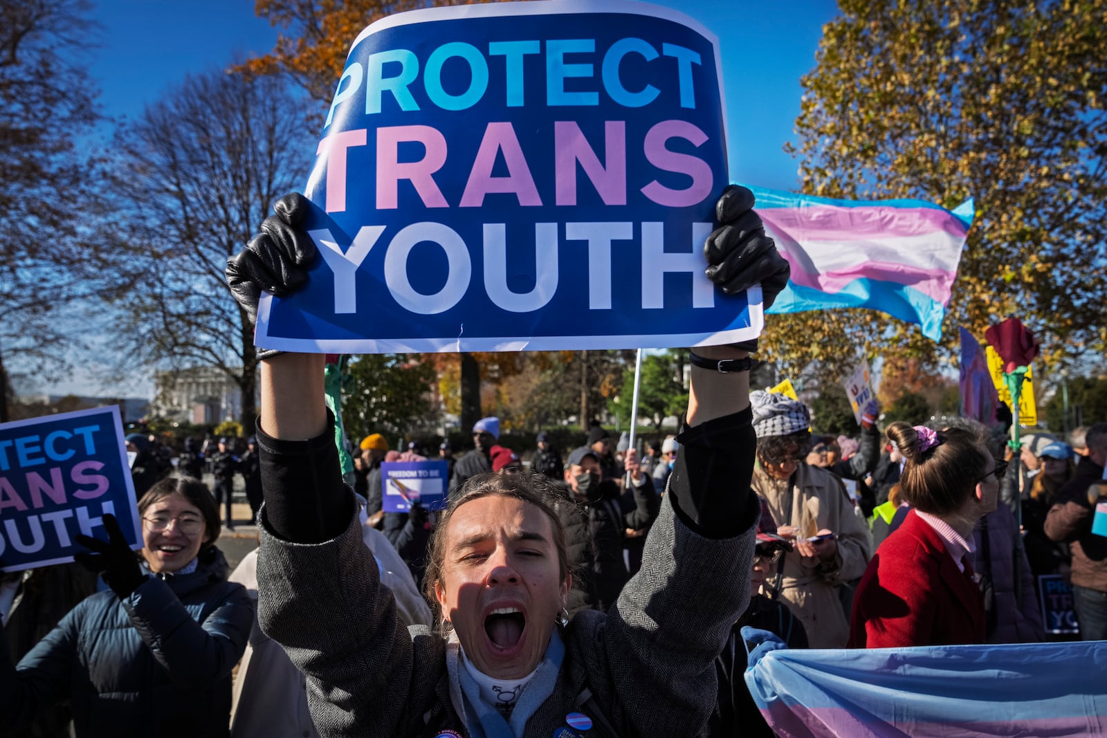 File - Supporters of transgender rights rally by the Supreme Court, Dec. 4, 2024, in Washington. (AP Photo/Jacquelyn Martin, File)