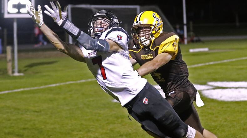 Tecumseh’s Clay Mastin dives for a touchdown pass under pressure from Kenton Ridge’s Zach Schnieder. Mastin was unable to pull the ball in and the pass was incomplete. Bill Lackey/Staff