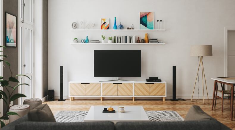 Are you a sports fan who subscribes to Disney+? You may soon be able to receive live sports from ESPN as a part of the video streaming subscription. Pictured is a living room with home entertainment center. IMAGINIMA/ISTOCK