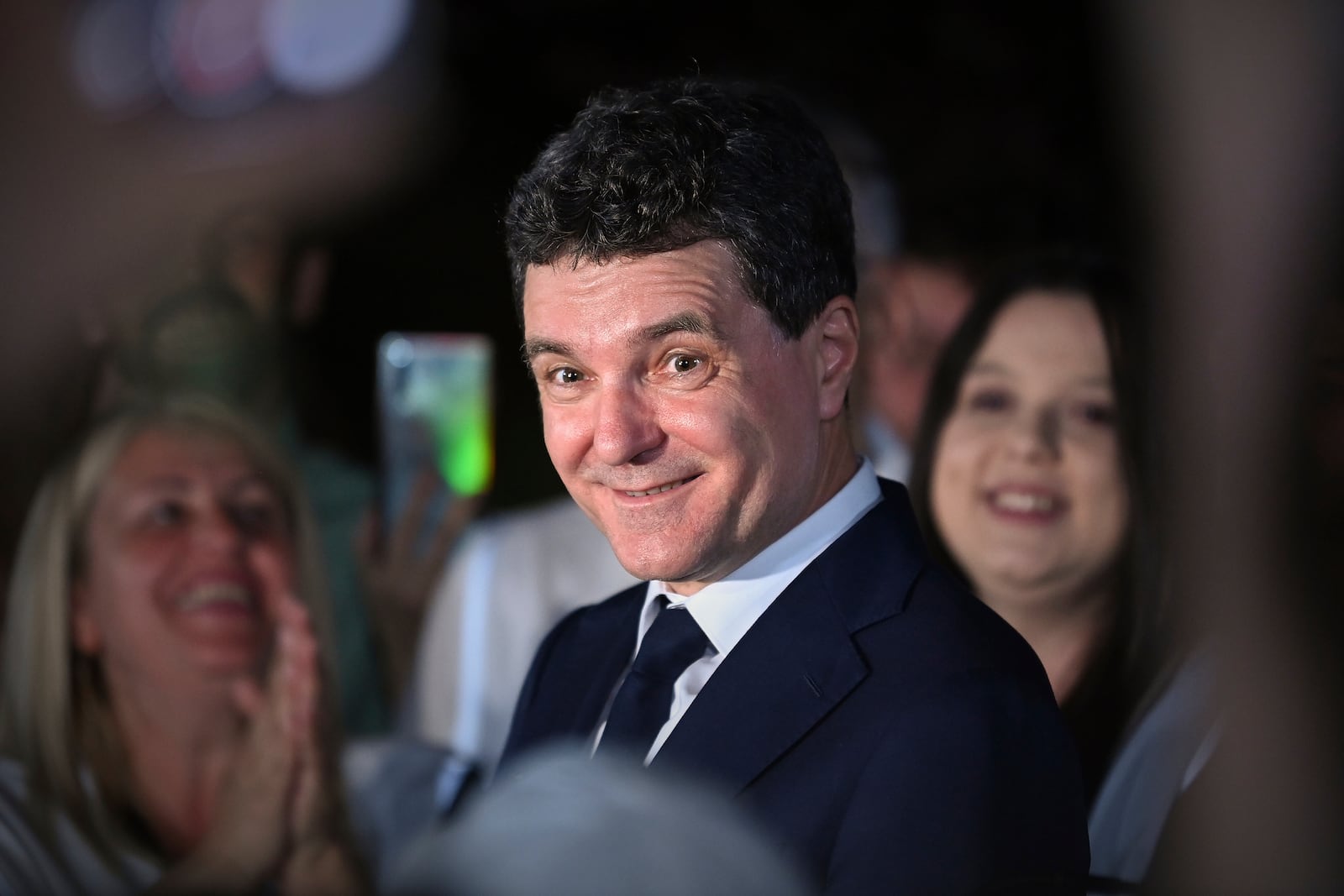 Presidential candidate Nicusor Dan smiles after polls closed in the first round of the country's presidential election redo in Bucharest, Romania, Sunday, May 4, 2025. (AP Photo/Eduard Vinatoru)