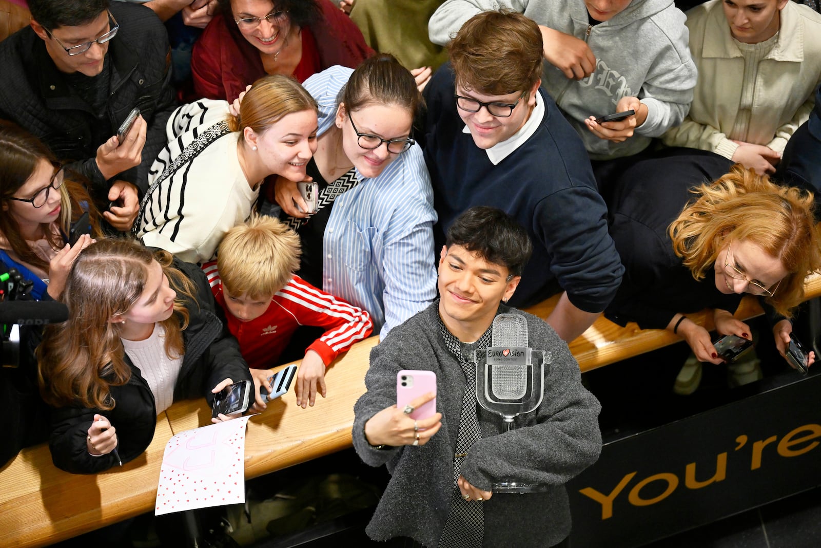 JJ, center, from Austria arrives at the airport in Vienna, Austria, Sunday, May 18, 2025, after winning the Grand Final of the 69th Eurovision Song Contest, in Basel yesterday. (AP Photo/Denes Erdos)