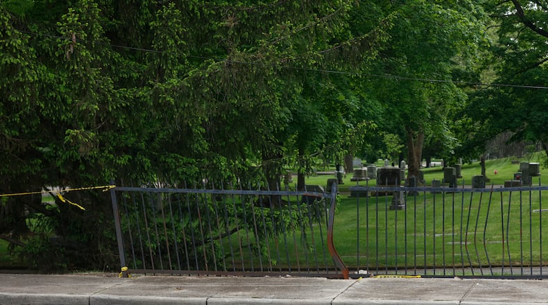The damaged fence of Ferncliff Cemetery on Tuesday, May 13, 2025. The fence has been hit by cars 65 times since 2018 and cemetery workers have advocated for changes to stop the accidents. JOSEPH COOKE/STAFF