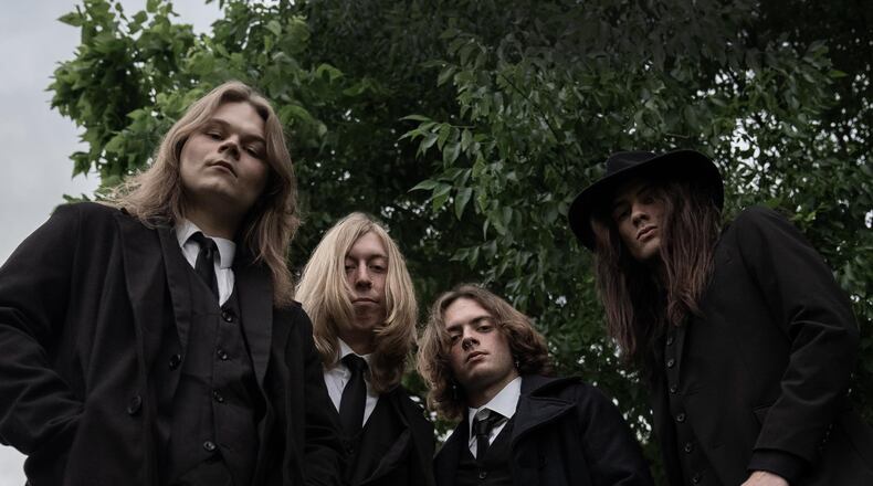 Hard rock band Dreadful Rumor will have a release party for its debut album and perform live along with three other bands at the State Theater on Saturday. Springfield native Eric Knabe, second from left, wrote many of the songs' lyrics based on his life here.