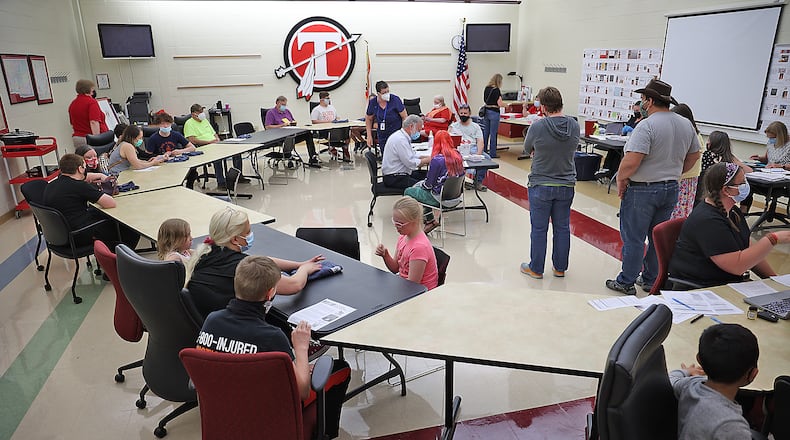 Clark County health district officials say vaccines within the minority community are down, but clinics going well, such as the one held at Tecumseh High School. BILL LACKEY/STAFF