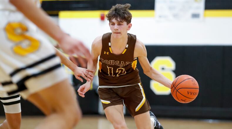 Kenton Ridge High School senior Ckai Rogan drives to the basket during their game at Shawnee last season. Michael Cooper/CONTRIBUTED