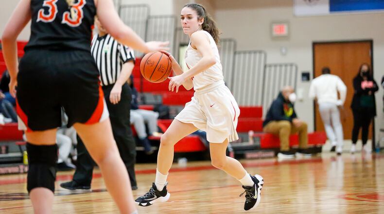 Cutline: Southeastern High School senior Lily Bertemes drives the ball to the hoop during their Division IV first round tournament game against Bradford on Monday night at Trotwood-Madison High School. The Railroaders won 46-39. Michael Cooper/CONTRIBUTED
