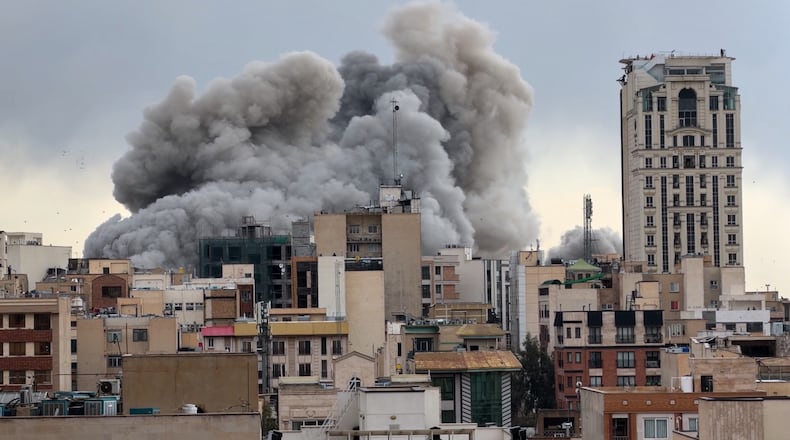FILE - A plume of smoke rises after a strike in Tehran, Iran, Monday, March 2, 2026. (AP Photo/Mohsen Ganji, File)