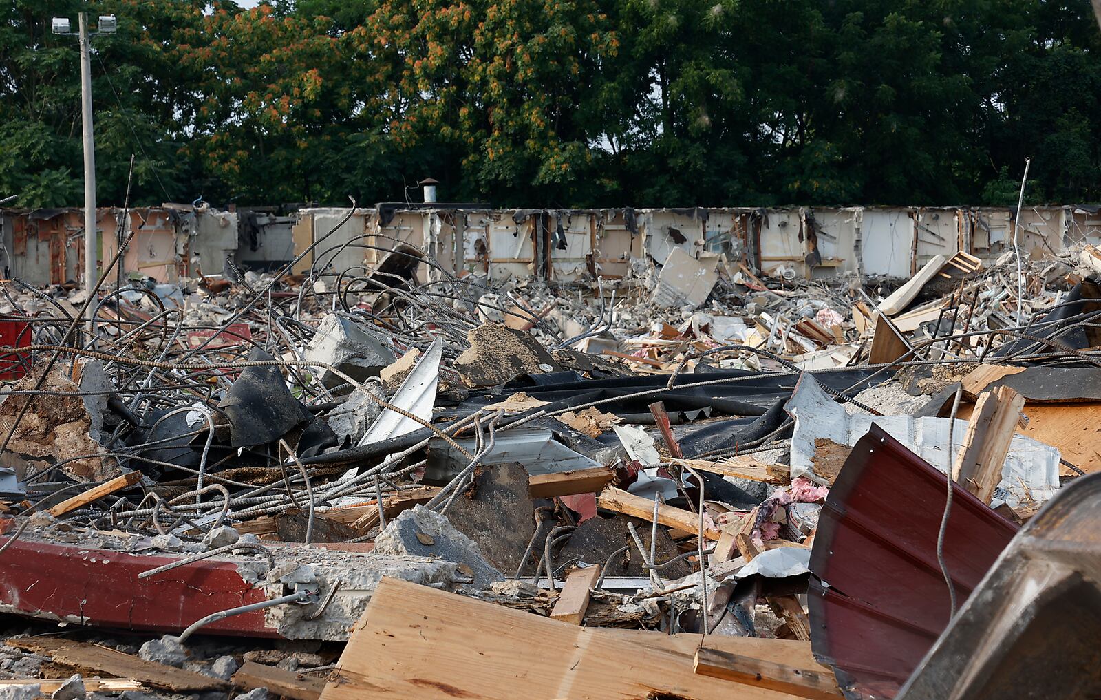 All that remains of the Villager Inn at 1715 W. North St. Monday, August 21, 2023, is the sign and a giant pile of rubble after it was demolished Saturday. BILL LACKEY/STAFF