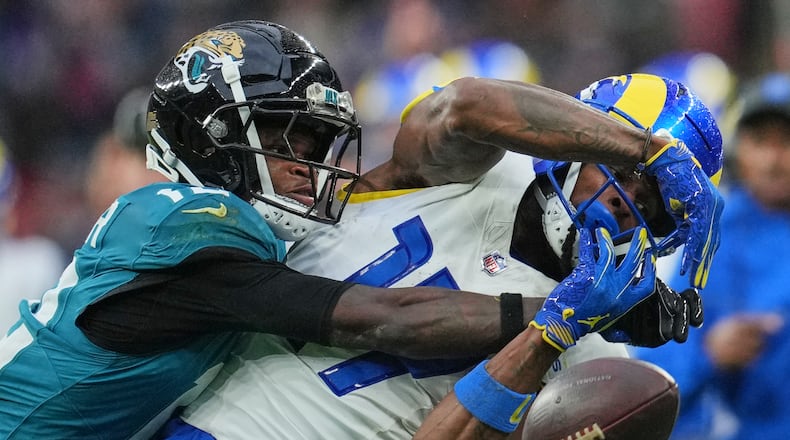 FILE - Los Angeles Rams wide receiver Davante Adams (17) is challenged by Jacksonville Jaguars wide receiver Travis Hunter (12) during the second half of an NFL football game between the Los Angeles Rams and the Jacksonville Jaguars in London, Sunday, Oct. 19, 2025. (AP Photo/Kin Cheung, File)