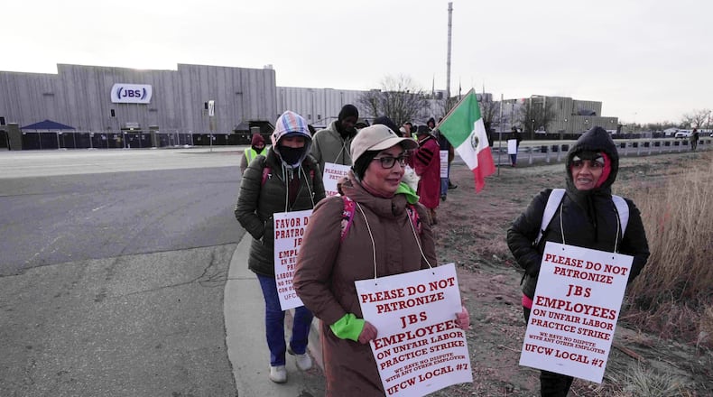 Meatpacking workers strike at Colorado's JBS-owned Swift Beef company Monday, March 16, 2026, in Greeley, Colo. (AP Photo/Brittany Peterson)
