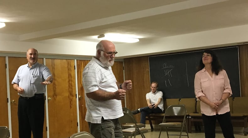 Steve Morgenstern, left, Don Bendure, Ryan Hester and Rebecca Baker rehearse for Springfield Civic Theatre’s upcoming production of the classic drama “Our Town.” CONTRIBUTED/BRETT TURNER
