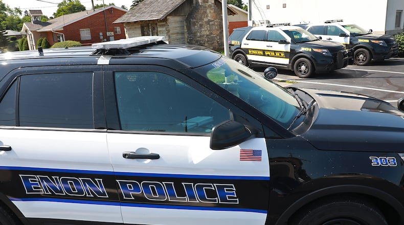 Police cars outside the Enon Police Department. BILL LACKEY/STAFF