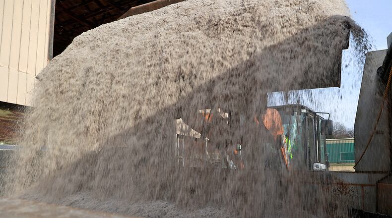City of Springfield service department employees fill a salt truck Wednesday, Dec. 21, 2022 as they prepare for the winter storm predicted for Thursday night. BILL LACKEY/STAFF