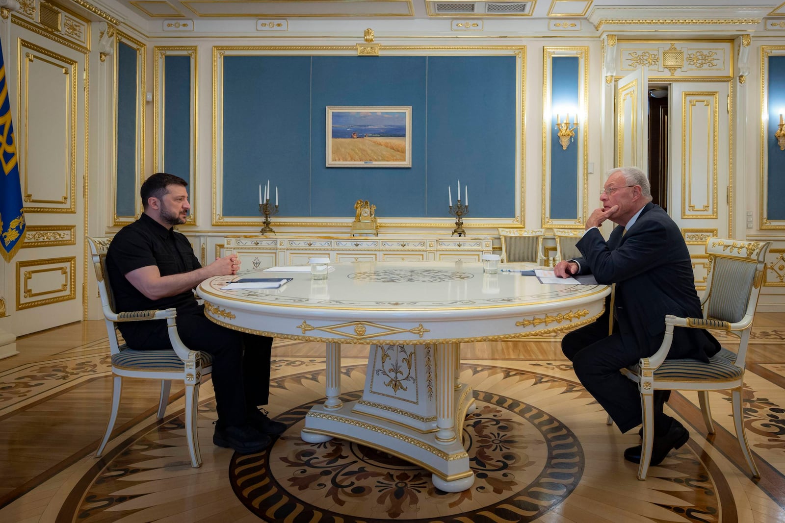 Ukrainian President Volodymyr Zelenskyy, left, and United States Special Envoy for Ukraine and Russia, Joseph Keith Kellogg talk in Kyiv, Ukraine, Monday, July 14, 2025. (Ukrainian Presidential Press Office via AP)
