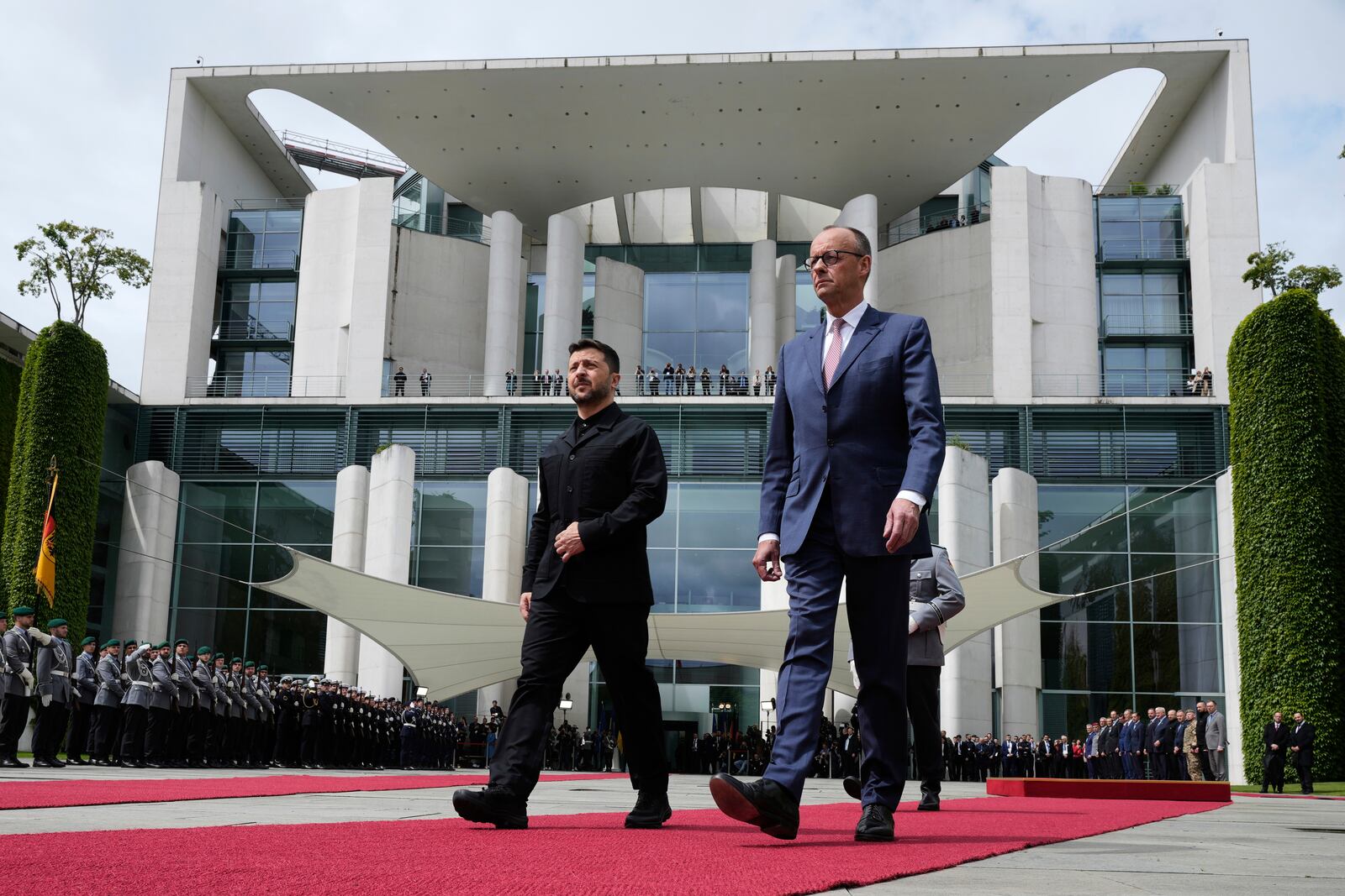Germany's Chancellor Friedrich Merz, right, welcomes Ukraine's President Volodymyr Zelenskyy during an official military reception at the chancellery in Berlin, Germany, Wednesday, May 28, 2025.(AP Photo/Markus Schreiber)