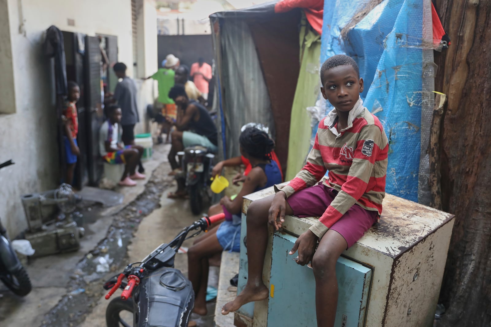 People displaced by gang violence live at the Ministry of Public Works, Transport and Communications office converted into a shelter in Port-au-Prince, Haiti, Tuesday, Sept. 9, 2025. (AP Photo/Odelyn Joseph)