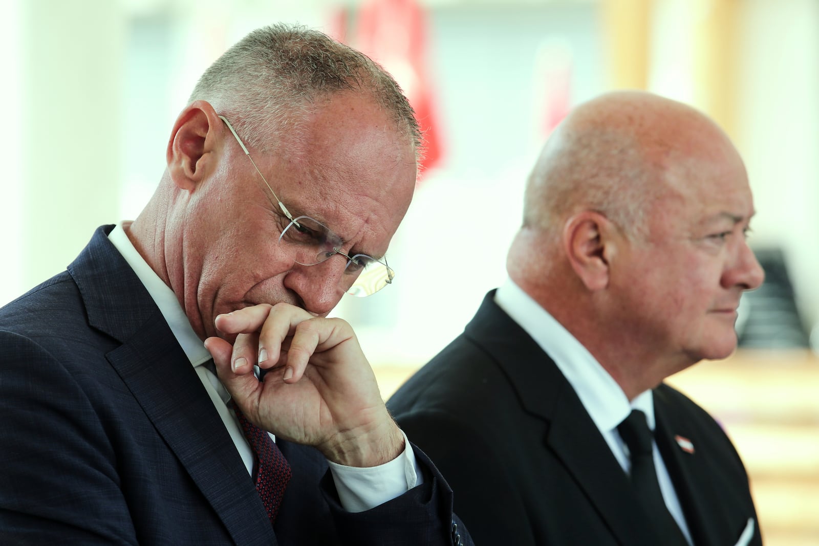 Austrian Interior Minister Gerhard Karner, left, and Chancellor Christian Stocker, right, attend a news conference following a shooting at a school in Graz, Austria, Tuesday, June 10, 2025. (AP Photo/Heinz-Peter Bader)
