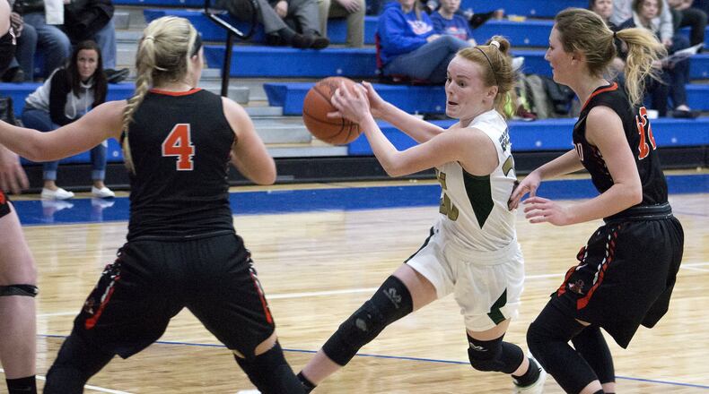 Catholic Central sophomore Lizzie Bruce drives against the defense of Bradford freshmen Austy Millier and Rylee Canan during the Railroaders’ 52-40 victory Tuesday in the Division IV sectional semifinals at Brookville High School. Jeff Gilbert/CONTRIBUTED