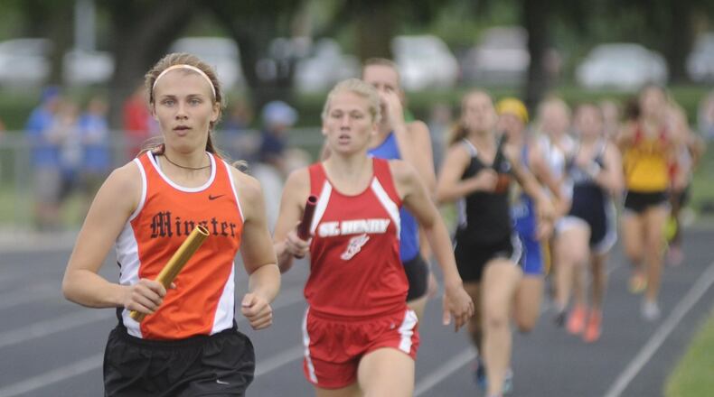Minster’s Cassie Francis in the 4x800 relay during the D-III regional track and field meet at Troy’s Memorial Stadium on Wednesday, May 24, 2017. MARC PENDLETON / STAFF