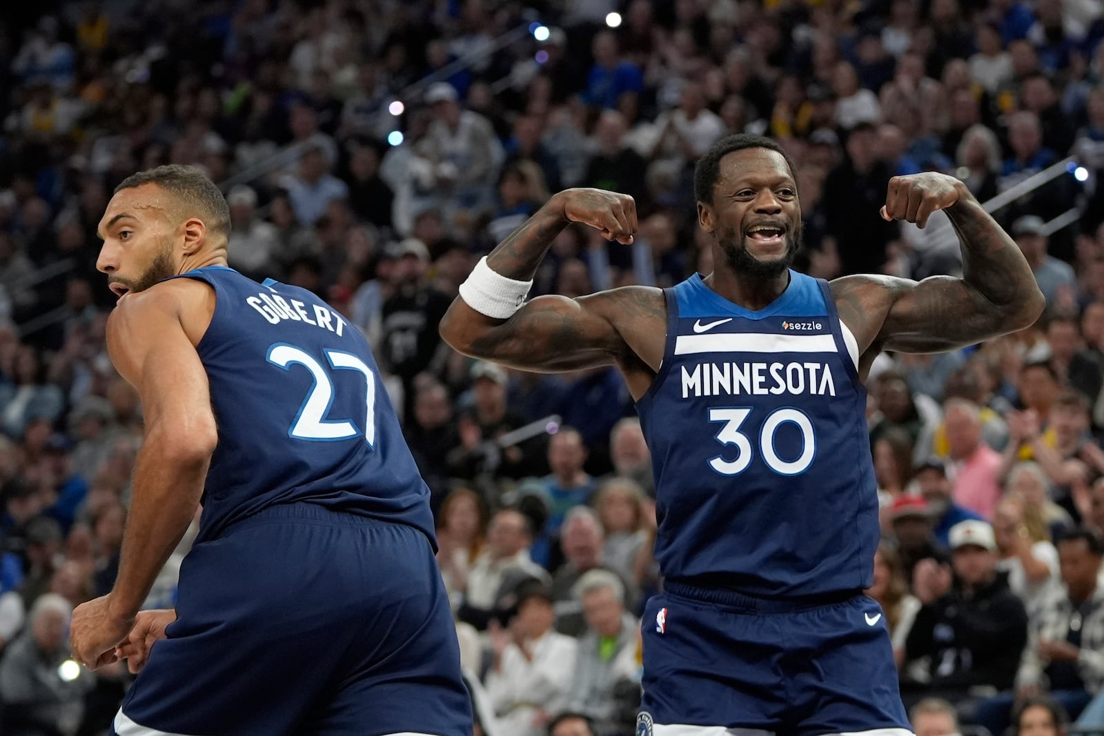 Minnesota Timberwolves forward Julius Randle (30) celebrates after a dunk during the first half of Game 4 of an NBA basketball first-round playoff series against the Los Angeles Lakers, Sunday, April 27, 2025, in Minneapolis. (AP Photo/Abbie Parr)