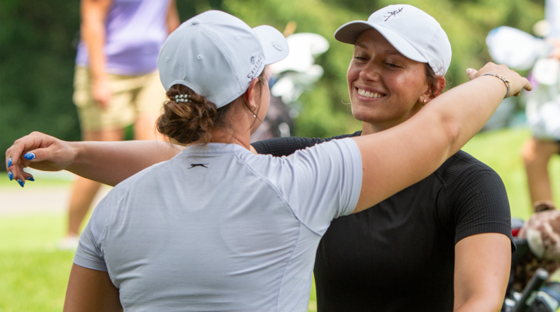 Former Lakota East standout Ellie Yeazell embraces her sister Clare after finishing with a 69 Wednesday at the U.S. Women's Amateur qualifier at Walnut Grove Country Club. Yeazell qualified for next month's national tournament in Oregon. JEFF GILBERT/CONTRIBUTED