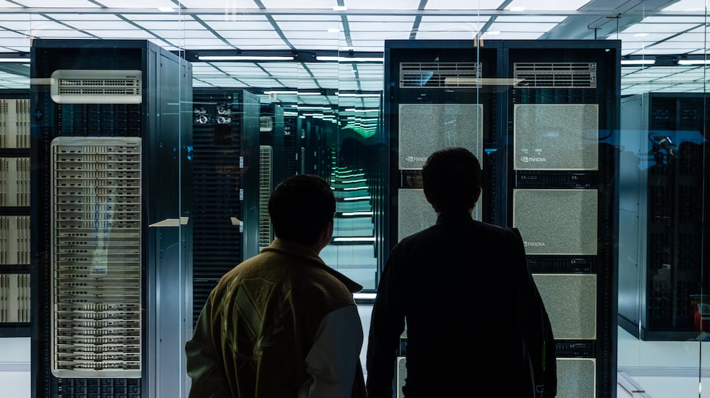 Attendees look at a display during the Nvidia GTC conference in Washington, on Tuesday, Oct. 28, 2025. Spending on data centers, which are filled with Nvidia chips, was a driving force behind the U.S. economic growth this year. (Eric Lee/The New York Times)