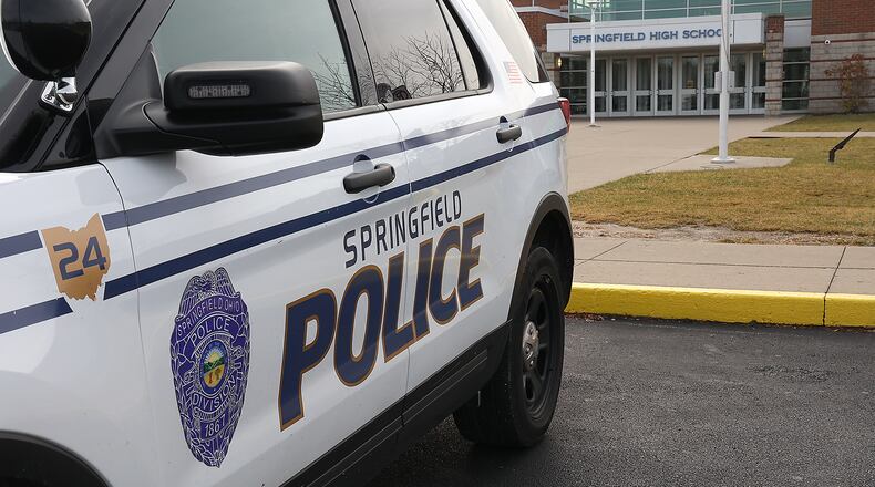 A Springfield Police patrol car, used by the school resource officer, sits in front of Springfield High School Friday. BILL LACKEY/STAFF
