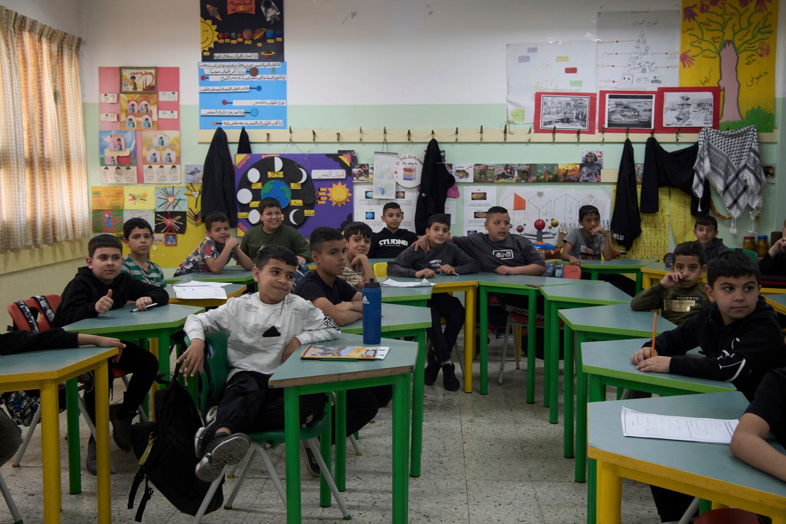 Students sit at their desks at the UNRWA Boys' School run by the U.N. agency for Palestinian refugees in the Shuafat Refugee Camp in east Jerusalem, in the Shuafat Refugee Camp in east Jerusalem, Tuesday, April 29, 2025. (AP Photo/Maya Alleruzzo)