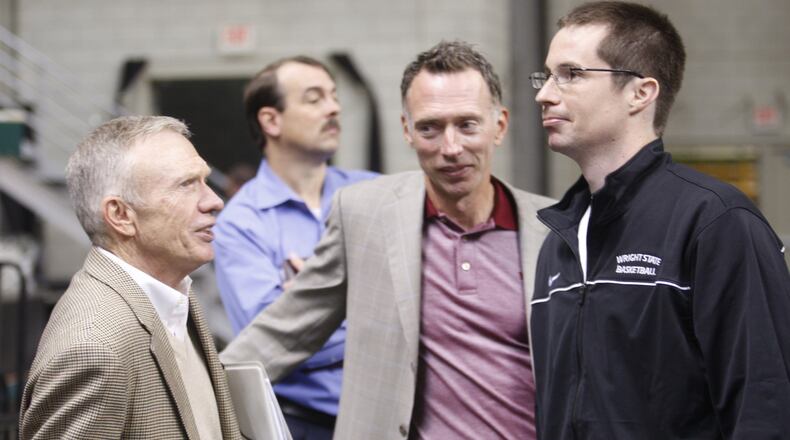 From left, Former Wright State Athletic Director Mike Cusack, current Athletic Director Bob Grant and men’s basketball head coach Billy Donlon have a small get together during Howloween Hoops event at the Nutter Center on Thursday, Oct. 28, 2010. DDN FILE