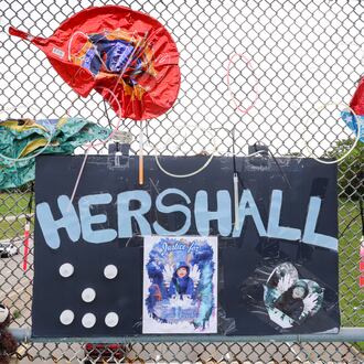 A memorial has been set up on the McClure Street bridge over U.S. 35 for Hershall Creachbaum, a 7-year-old who was found dead on July 12, 2025. Balloons, stuffed animals and signs are among items people have left. BRYANT BILLING / STAFF