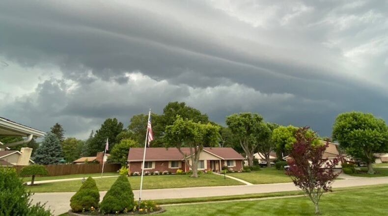 Gray clouds and storm wall was seen moving into south Kettering Friday morning on June 18, 2021. SUSAN CARROLL / STAFF