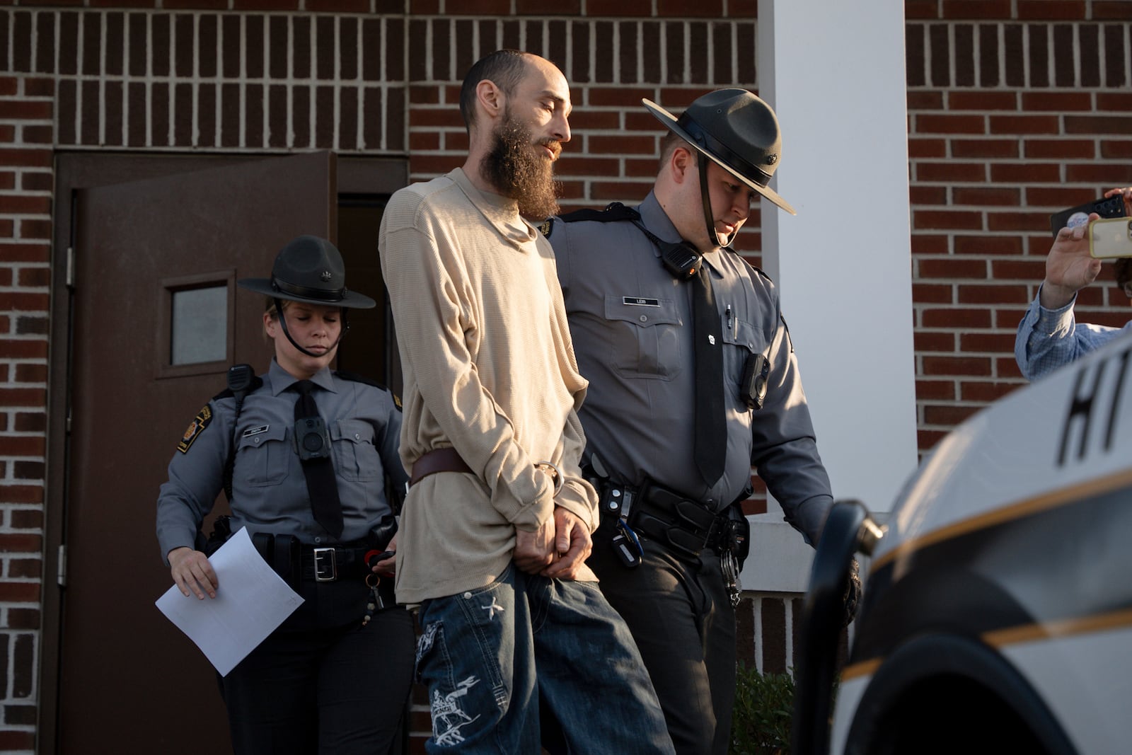 Cody Balmer is escorted from court after his preliminary arraignment on Monday, April 14, 2025, in Harrisburg, Pa. (AP Photo/Mingson Lau)