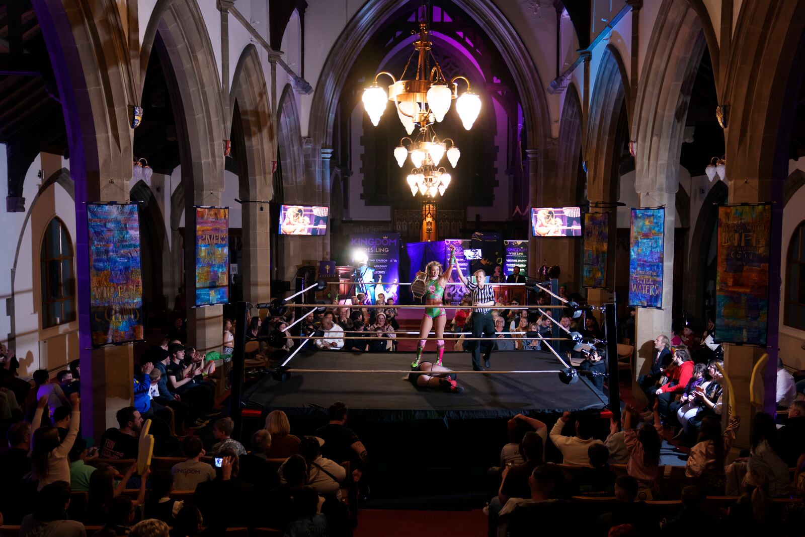Stephanie Sid aka Tiara is proclaimed winner over Sarlett during a Kingdom Wrestling show at St Peter's Church in Shipley, Saturday, March 29, 2025. (AP Photo/Jon Super)