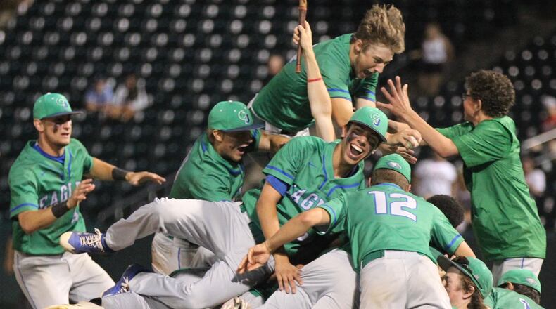 Chaminade Julienne celebrates a victory against Wapakoneta in the Division II state championship on Saturday, June 2, 2018, at Huntington Park in Columbus. David Jablonski/Staff